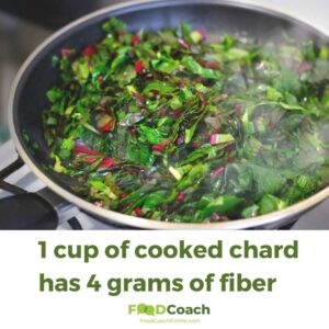 swiss chard cooking in a frying pan with chard fiber nutrition fact information