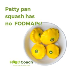 Bright yellow fodmap free patty pan squash in a white bowl